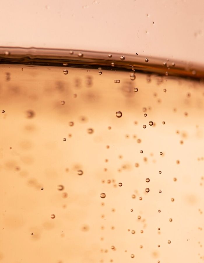 Close-up of bubbles in a transparent liquid symbolizing high bioavailability.